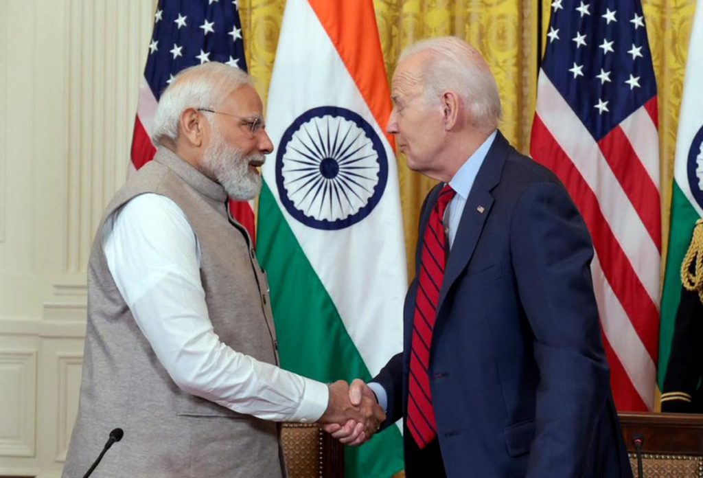 Prime Minister of India (left) and President of the USA (right) sign DTAA for Non-Resident Indians.